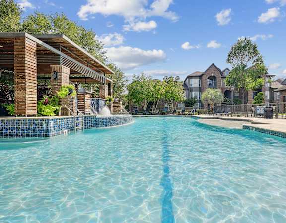 A large swimming pool in a residential area.