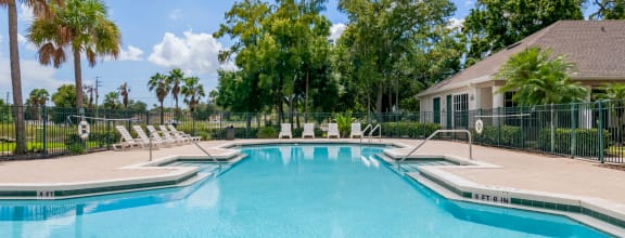 pool and hot tub at the whispering winds apartments in pearland, tx