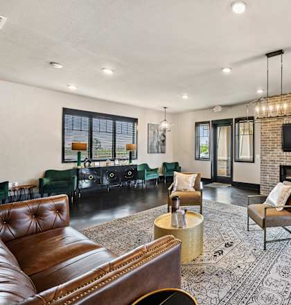 a living room with a fireplace and a television