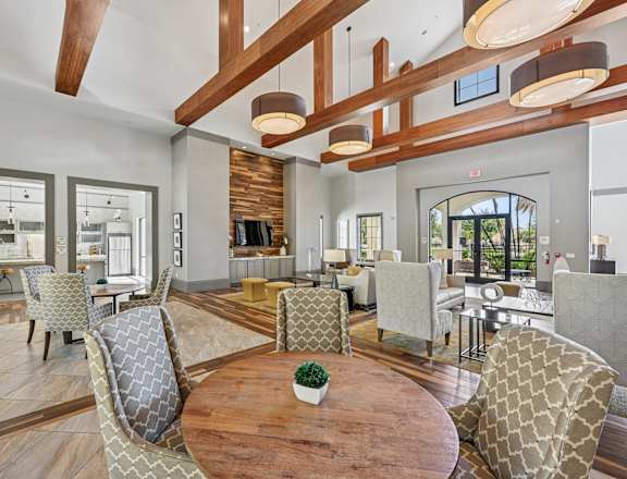A modern living room with wooden floors and furniture.