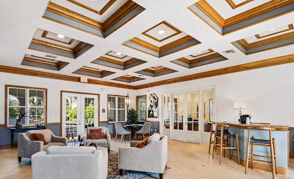 a living room with coffered ceilings at Floresta, Jupiter, Florida