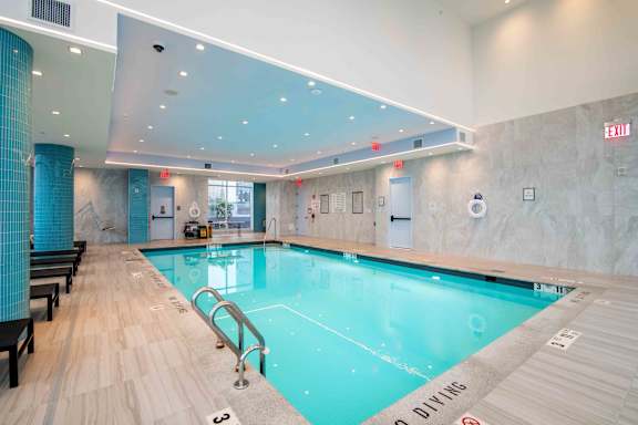 a swimming pool in the lobby of a hotel