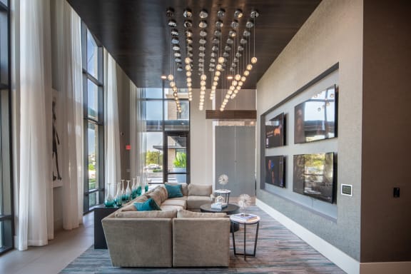 a living room with a large couch and a large window