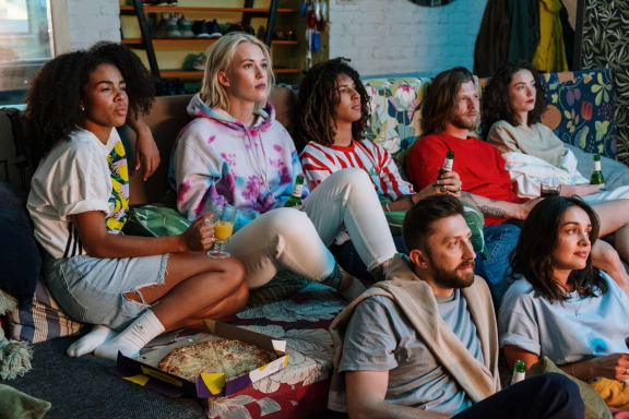 a group of people sitting on a couch