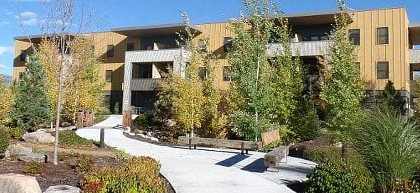 A modern building with a walkway in front of it.