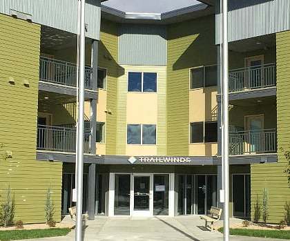 The front of a building with the name "Halifax Winds" on it.
