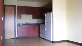 Kitchen with fridge and range