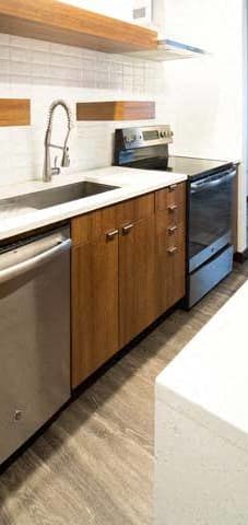 a kitchen with stainless steel appliances and a sink