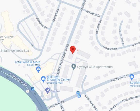 a map of a neighborhood with a red point at the intersection of a road and