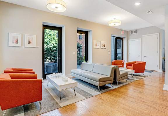 a living room with couches and chairs and a coffee table