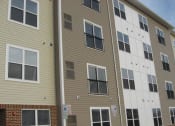 Thumbnail 6 of 6 - a white and tan building at Rosewood Village, Hagerstown, MD