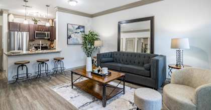 Living Room with Wooden Floor at Avenues at Tuscan Lakes, Texas