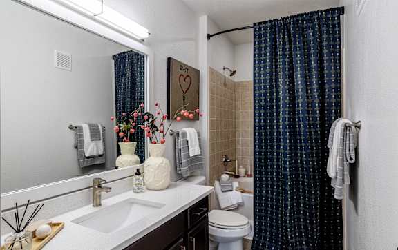 Bathroom with blue curtain at Grand Villas at Cinco Ranch, Texas