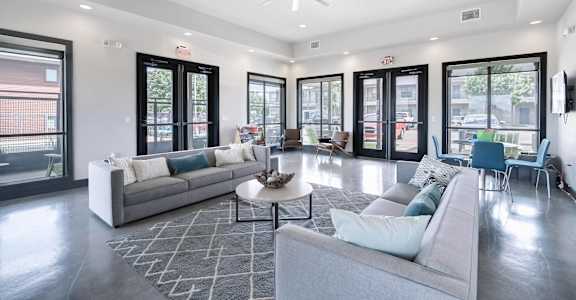 a large living room with couches and a coffee table