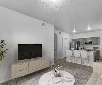 our apartments offer a living room with a couch a coffee table and a flat screen tv