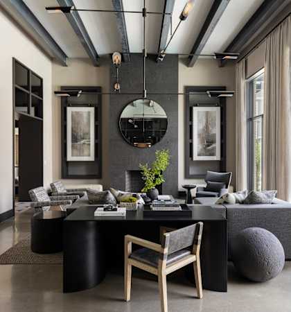 A modern living room with a black and white color scheme.