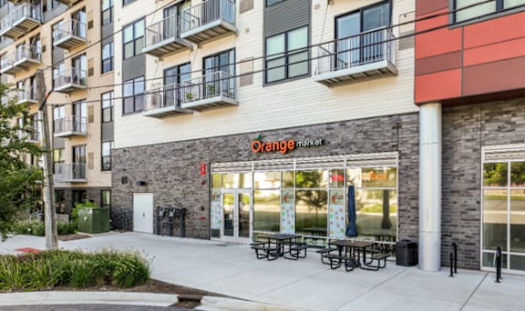 A storefront with the name "orange" on it.