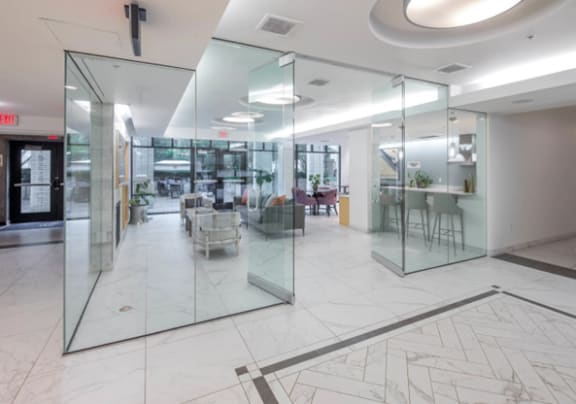 A glass partitioned room with a marble floor. at The Parker in Portland, 97209