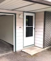 A garage with a door that has the number 215 on it.