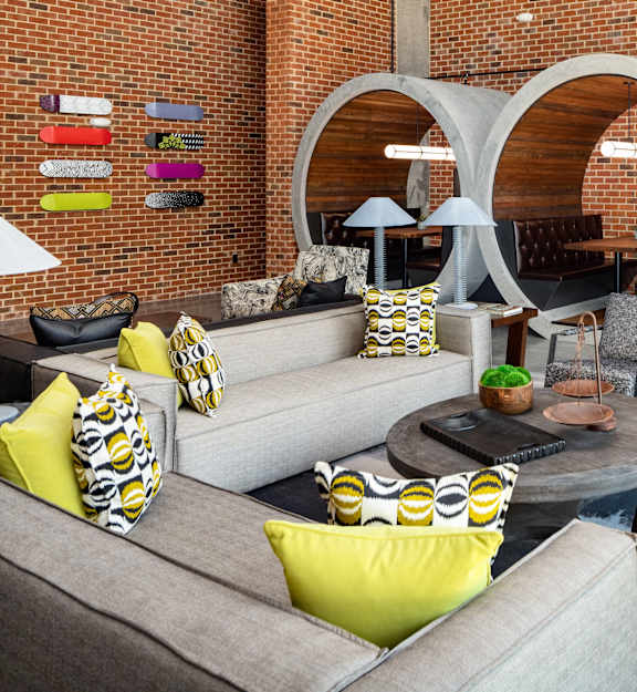 a living room with couches and chairs and a table