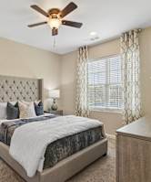 Bedroom with ceiling fan at The Ridge at Calhoun, Calhoun, GA, 30701