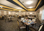 Thumbnail 7 of 31 - A restaurant with tables set for dining.