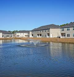 a pond in the center of an apartment complex  at The Meadows, Georgia