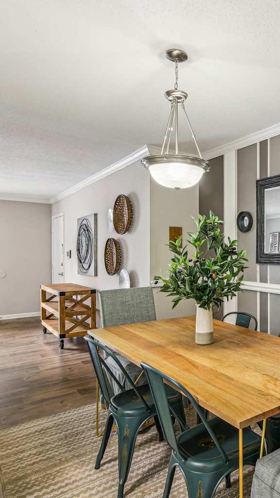 A 3D floor plan of a house with a kitchen, living room, and bedrooms.