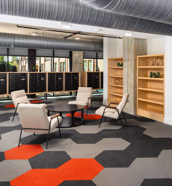 a room with chairs and tables in a library