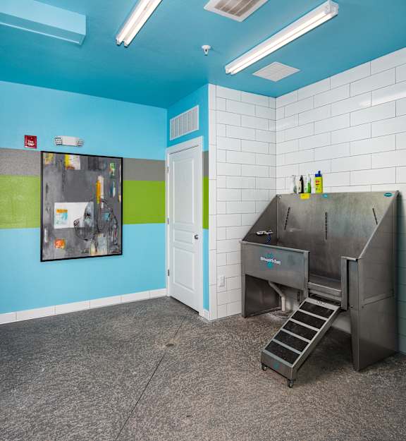 a kitchen with a sink and a stove in a room