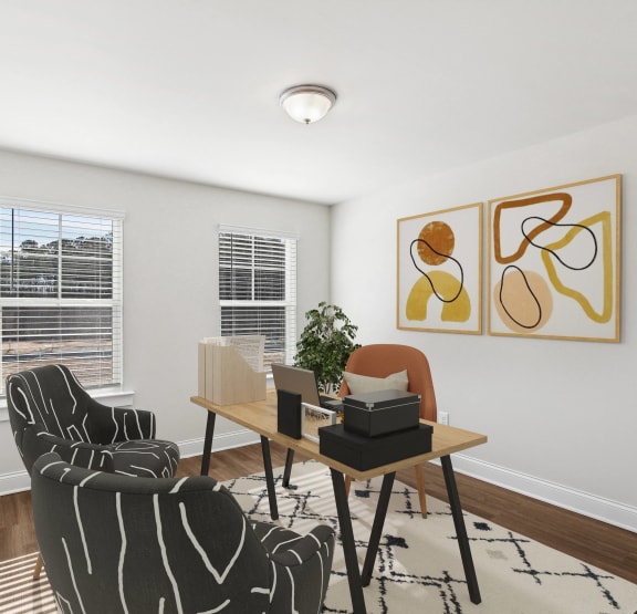 a living room with two chairs and a table and two windows