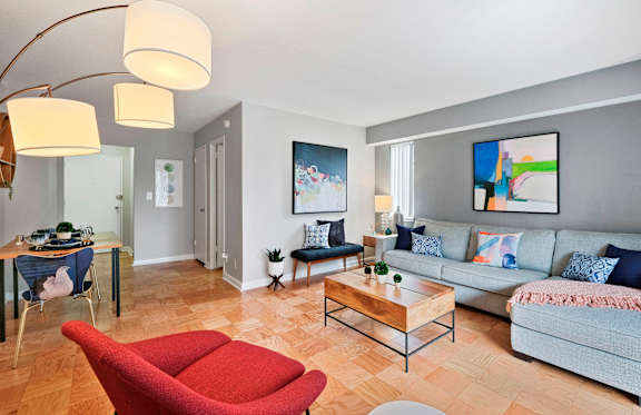 a living room with couches and chairs and a coffee table