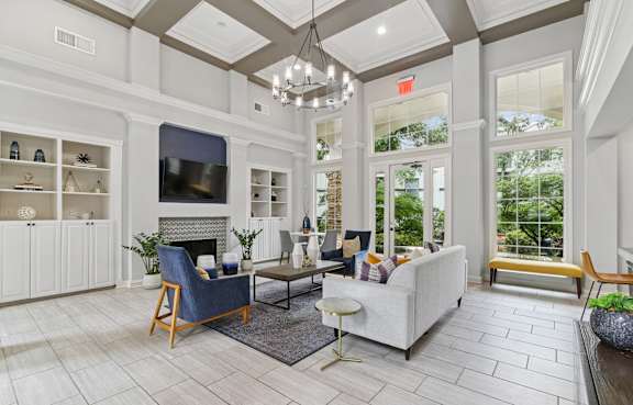 A living room with a fireplace and a television.