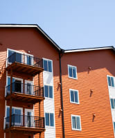 a woman covering her face with a blanket at The Mill on Maple Apartments, Oregon City, OR 97045