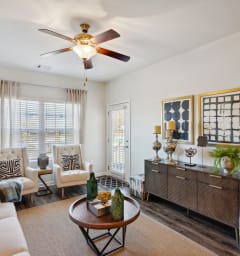 a living room with furniture and a ceiling fan  at The Meadows, Bloomingdale, GA