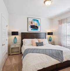 a bedroom with a large bed and a window  at The Meadows, Georgia, 31302
