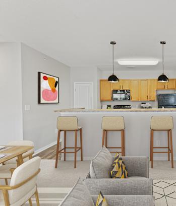 A modern kitchen with a bar area and a dining table with chairs.