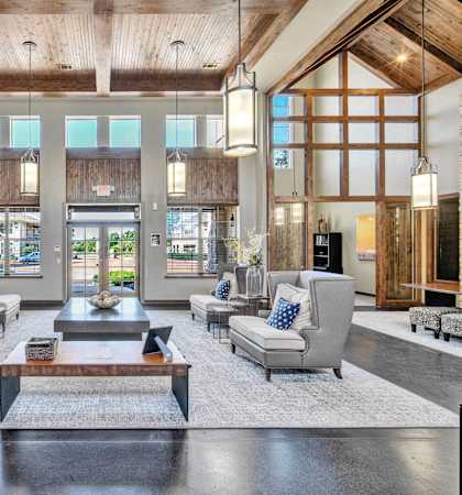 a large living room with couches and a coffee table
