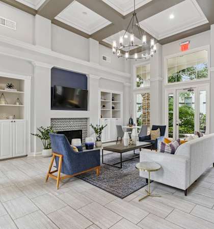 A living room with a fireplace and a television.