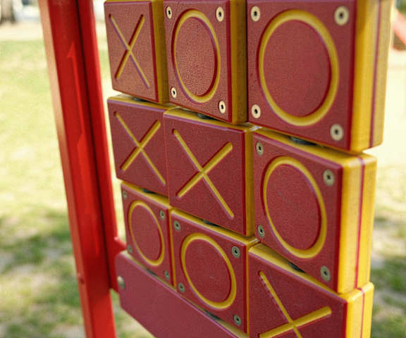 A red and yellow XOXO sign on a pole.