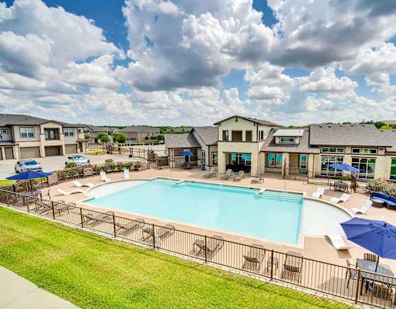 the preserve at ballantyne commons pool and resort style buildings with umbrellas