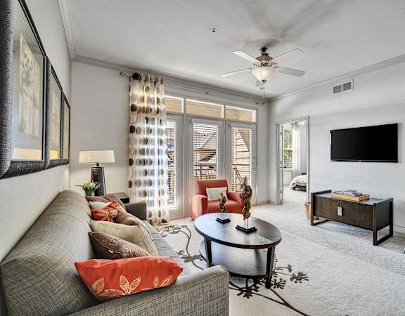 a living room with a couch and a tv