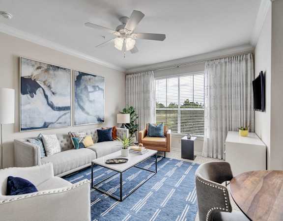 a living room with couches and chairs and a coffee table