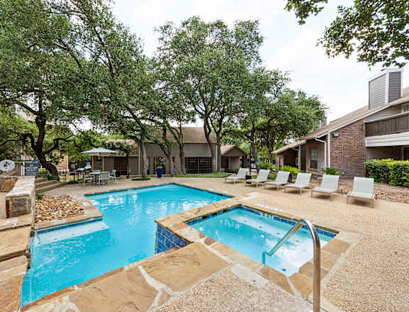 our apartments have a swimming pool and a patio with chairs