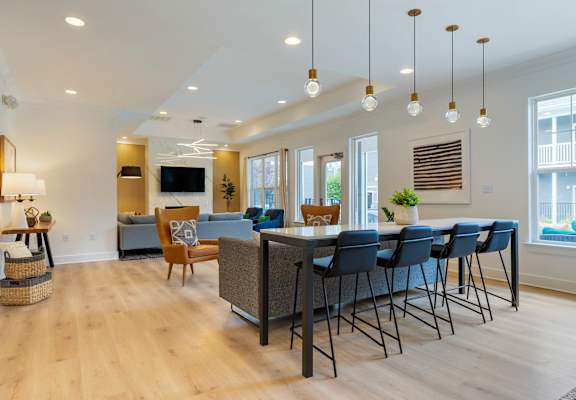 a living room filled with furniture and a large window