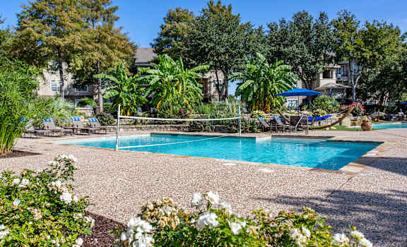 a swimming pool is shown in front of a resort style pool  at The Brazos, Texas, 75287