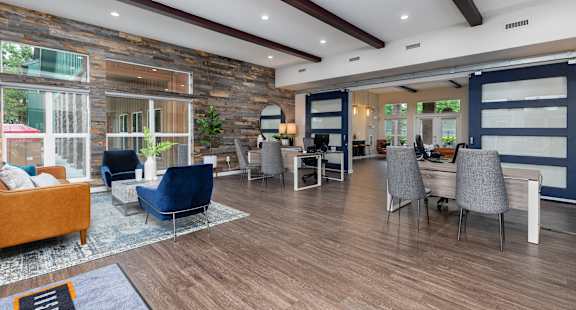 the preserve at ballantyne commons community room with couches and chairs and tables