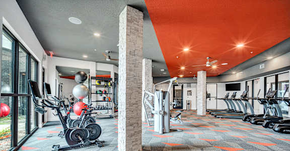 the gym at the flats at big tex apartments