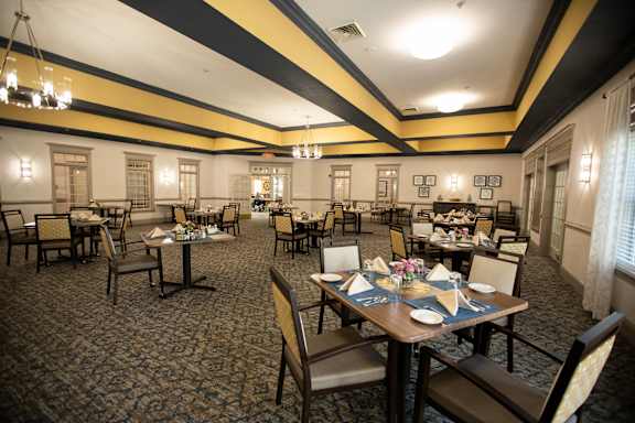A restaurant with tables set for dining.