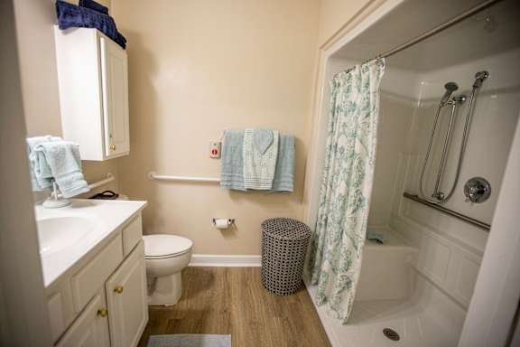 A bathroom with a toilet, sink, and bathtub.
